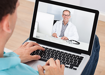 Patient talking to doctor via video conferencing