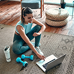 Person exercising with a laptop